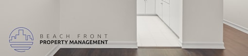 A kitchen area with a logo of Beach Front Property Management.