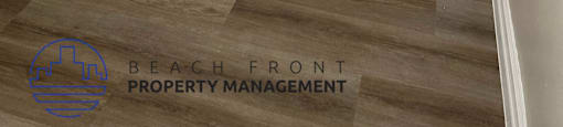 A white closet with a door and a logo for Beach Front Property Management.