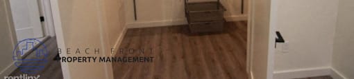 a large closet in a small room with a wooden floor