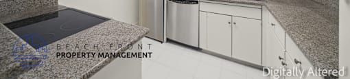 A kitchen with granite countertops and stainless steel appliances.