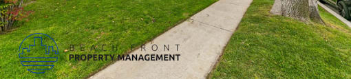 a sidewalk in front of an apartment building