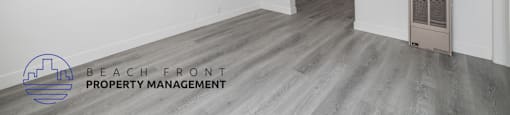 A room with a logo of Beach Front Property Management.