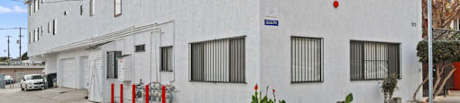 A white building with a blue sign on the front.
