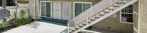 A building with a staircase leading to the second floor.