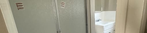 a bathroom with a shower and a toilet in it