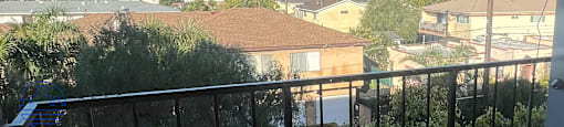A view of a residential area from a balcony.