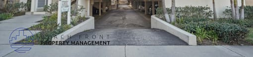 A beachfront property with a sign for Beachfront Property Management.