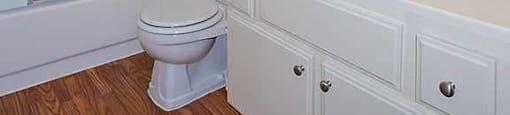 a bathroom with a sink toilet and a mirror