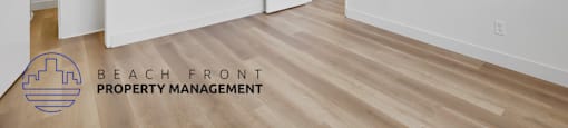 A room with a logo of Beach Front Property Management.