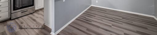 A room with wooden floors and white walls.