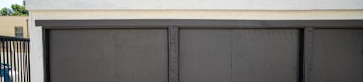 A garage door is closed and locked.