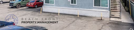 A building with the number 1037 on it is managed by Beach Front Property Management.