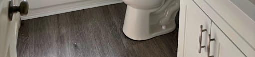 a bathroom with a shower and a toilet and a sink
