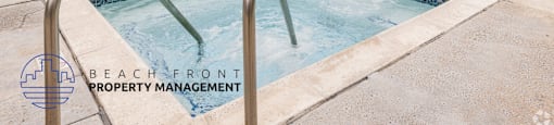 A pool with a slide and a logo for Beach Front Property Management.