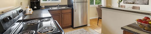 a kitchen with a stove and a refrigerator