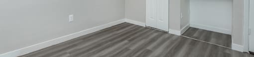 a living room with grey walls and a white door