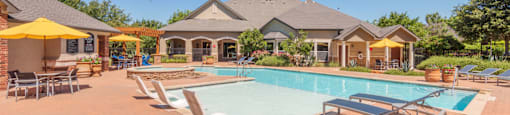 Pool, lounge chairs, and cabanas  at Parmer Place Apartments in Austin