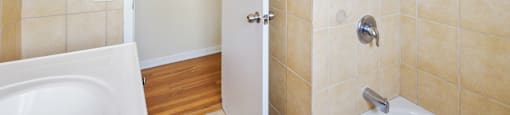 a bathroom with a shower and a toilet and a sink