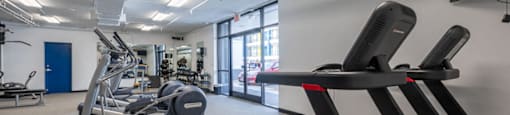 the gym at the flats at obsidiancontinued furnished area with exercise equipment