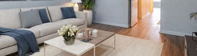 a living room with a white couch and a coffee table