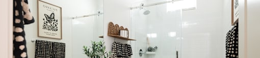 A bathroom with a white sink and a white toilet.