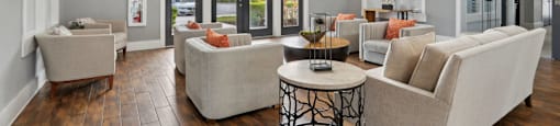 A living room with a white couch and a coffee table.