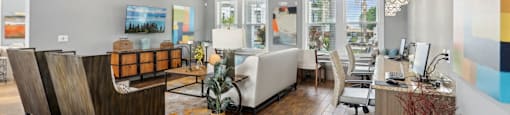 A modern office space with wooden floors and white walls.