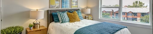 bedroom with green and white comforter at Brixton South Shore, Austin, 78741