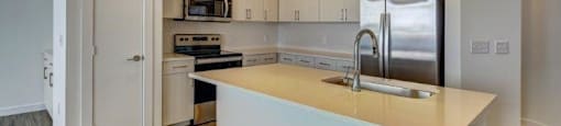 kitchen with an island at Brixton South Shore, Austin, TX, 78741