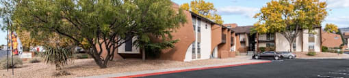 an empty street in front of an apartment building