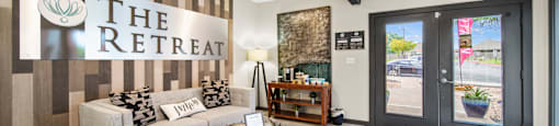 the retreat apartments l living room with couch and coffee table