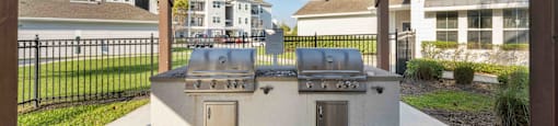 an outdoor kitchen with a pergola