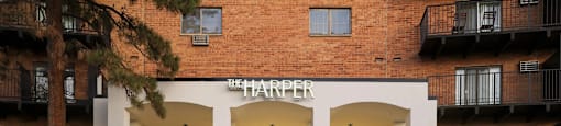 The Harper building has a black fence around it.