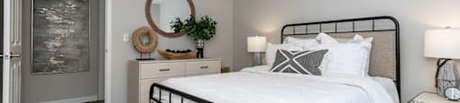 a bedroom with a bed and a ceiling fan