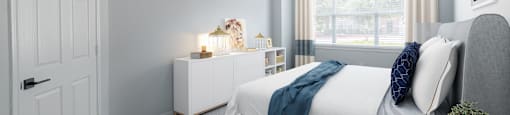 a bedroom with a bed and a ceiling fan