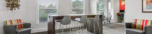 A modern dining room with a wooden table and grey chairs.