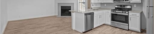 A spacious kitchen with a wood floor and white appliances.