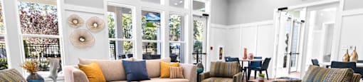a living room with couches and chairs and a table
