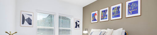 a bedroom with a bed and a desk
