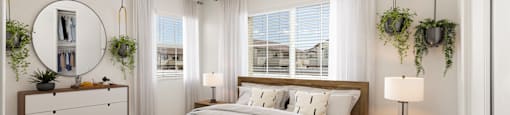 A bedroom with a large bed, a dresser, and a window with white curtains.