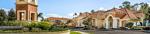 a roundabout in front of a building with a clock tower
