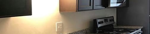 Upgraded townhome with granite countertops, stainless steel appliances and plank flooring