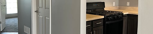 A kitchen with a black stove top oven and microwave.