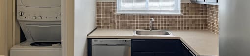 A kitchen with a white oven and black cabinets.