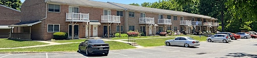 A black car is parked on the left side of the street.
