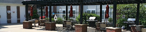 Covered gas grills on pool deck