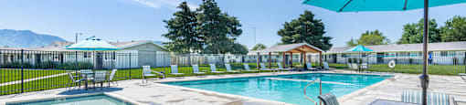 our apartments have a resort style pool and patio at Cadence Apartments, Roy, UT 84067
