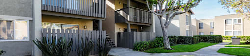 a sidewalk in front of an apartment building at CASA GRANDE APARTMENT HOMES, Cypress, California