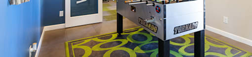 Lounge area with games at CHANDLER APARTMENT HOMES, Las Vegas, 89139