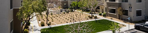 an aerial view of an apartment complex with a green courtyard at CHANDLER APARTMENT HOMES, Las Vegas